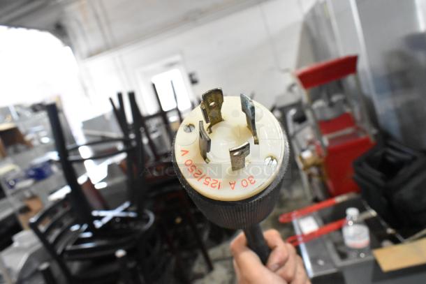 Close-up of a power plug for a Taylor 754-33 ice cream machine. Marked "30 A 125/250 V". Suitable for 208/230 volts, 3 phase.