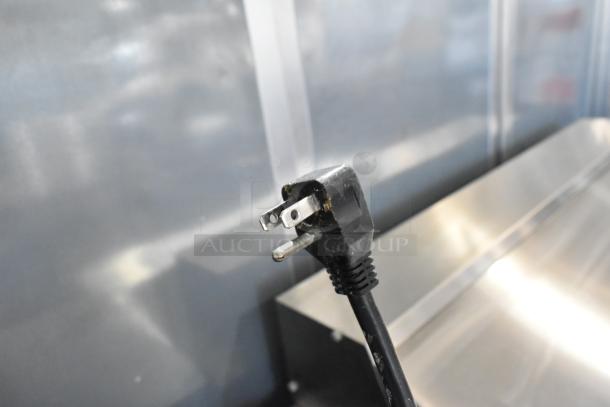 Power cord for Entree BB-2SD-38 commercial cooler, 115 volts, shown against metal surface.