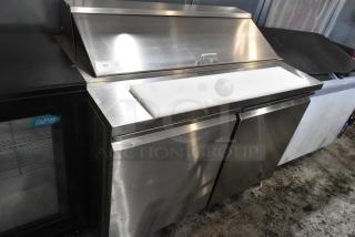 Entree S48 stainless steel prep table, bain marie mega top, 115 volts, 1 phase, double-door, cutting board, good condition.