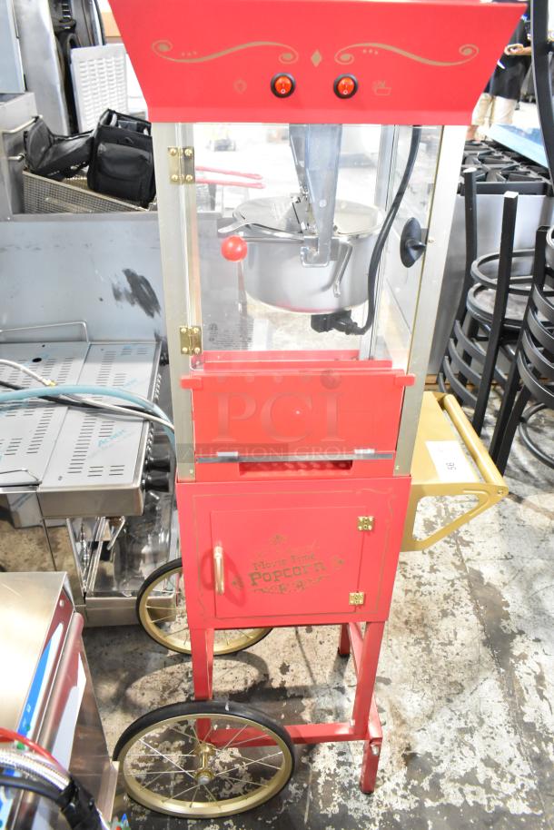 Nostalgia CCP510 vintage popcorn cart, red metal, 120V, 1 phase, gold accents, large wheels, "Movie Time Popcorn" label.