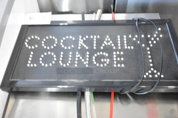 Cocktail Lounge light-up sign, black with white bulb letters, 115 volts, 1 phase, rectangular frame, visible wiring.