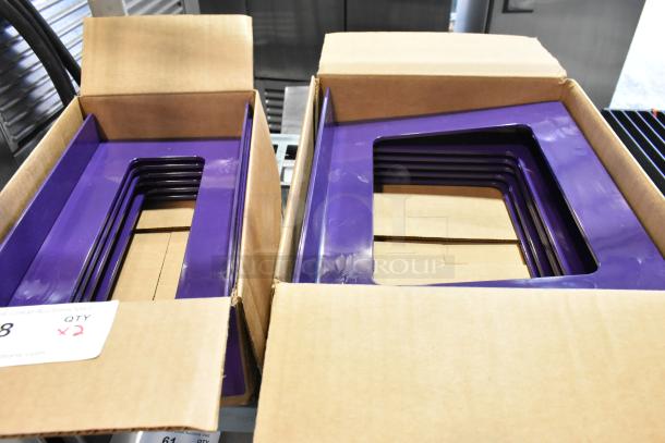 Two boxes of stacked metal purple frames in new condition. Contains quantity label indicating double bid offer.