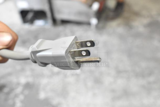 Close-up of the power plug for a 2024 Solwave 180MW1000SS Commercial Microwave, 120V, 1 Phase, in stainless steel.