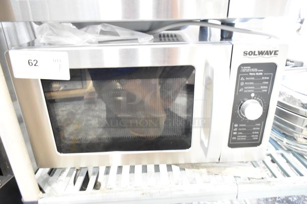 2024 Solwave 180MW1000D stainless steel commercial microwave with dial control, 120 volts, label visible, excellent condition.