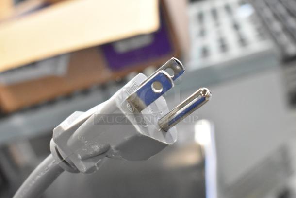 Close-up of the plug for a 2024 Solwave 180MW1000D commercial microwave, showing a three-prong design for 120 volts, 1 phase.