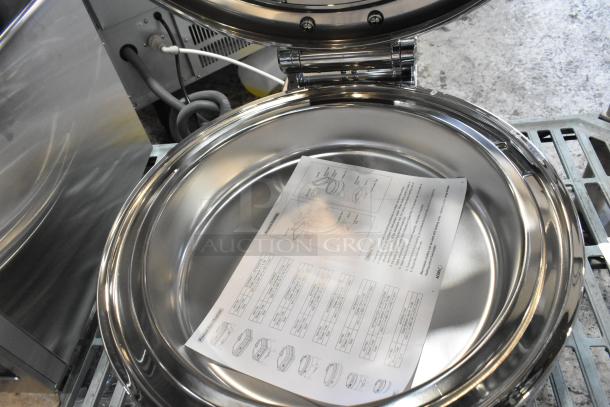 Stainless steel round chafer, brand new with minor scratches and dents. Manual included inside.