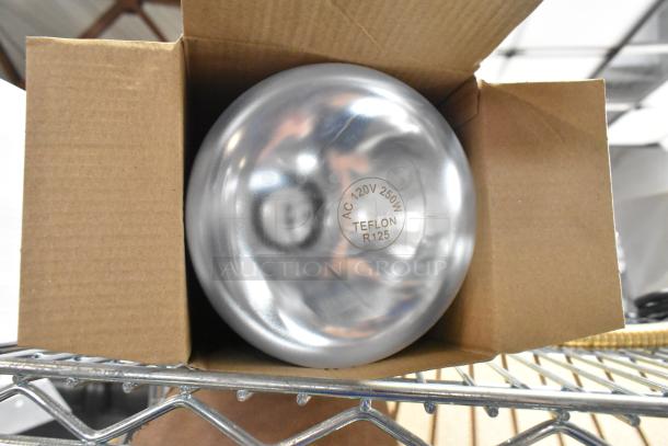 Alt Text: Brand new R125 Teflon lightbulb with minor scratch and dent, 120V, 250W, shown in open cardboard box.