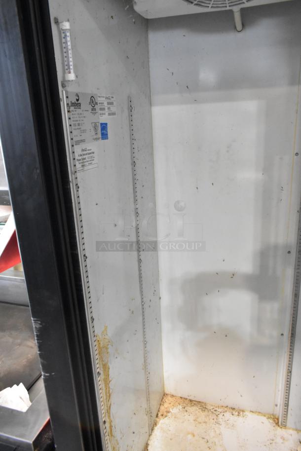 Imbera VRD37 commercial cooler interior with racks, visible cleanliness wear, 115V, 1-phase. Model labels shown.