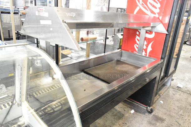 BKI Metal Commercial Buffet Station, on casters, 125/208V, 1 Phase, stainless steel, with visible labels, in good condition.