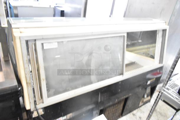 Federal Industries SN6CD-2 commercial metal display case, floor style, 120V, 1 phase, sliding doors, moderate wear.