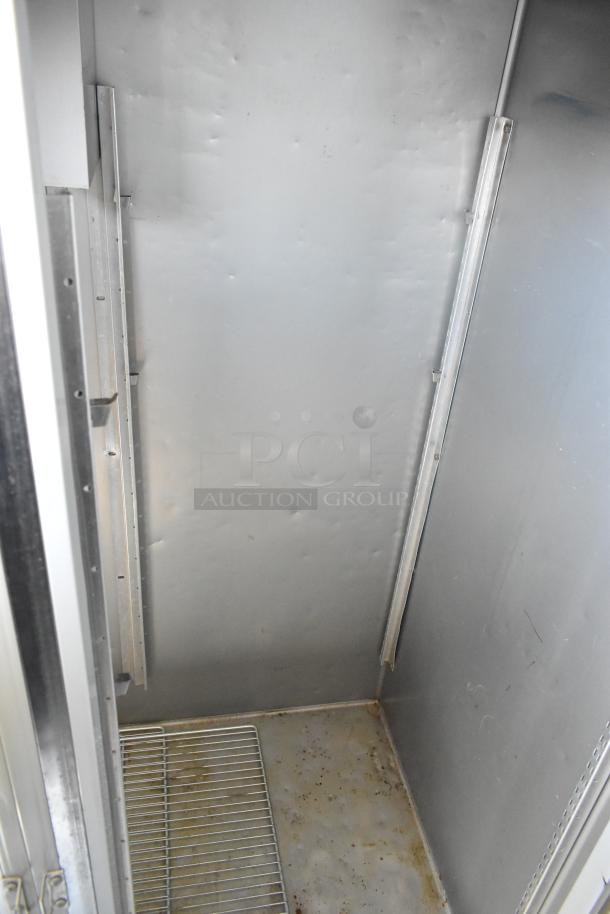 Hobart stainless steel commercial 2-door reach-in cooler interior, 115 volts, 1 phase, visible shelving, some wear.