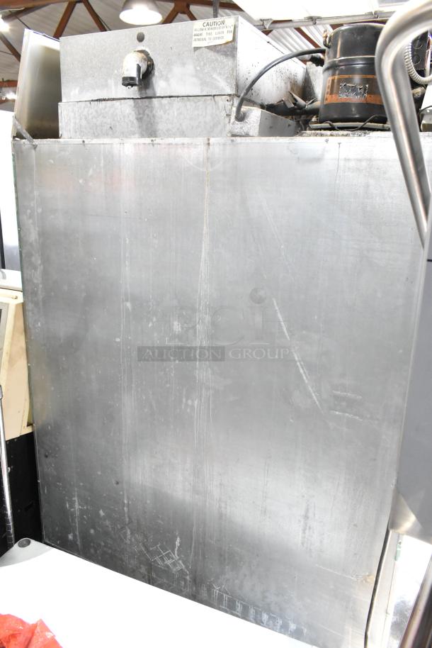Hobart stainless steel commercial 2-door reach-in cooler, 115 volts, 1 phase. Features visible wear.