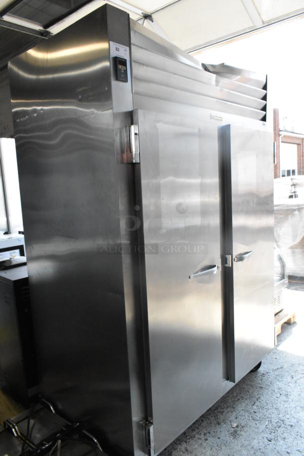 Traulsen RHT232WUT-FHS stainless steel 2-door commercial cooler on casters. 115V, 1 phase. Clean exterior, visible handles.