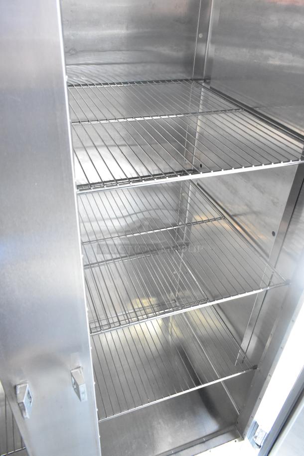 Traulsen RHT232WUT-FHS stainless steel 2-door reach-in cooler, with shelving, on commercial casters. 115V, 1 phase.