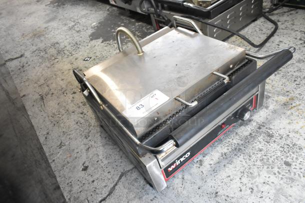 Winco EPG-1C stainless steel panini press, commercial countertop model, visible wear, 120V, 1 phase, auction tag "83".