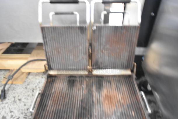 2020 Waring WPG300 stainless steel commercial double panini press, 240 volts, with visible wear, model WPG300.