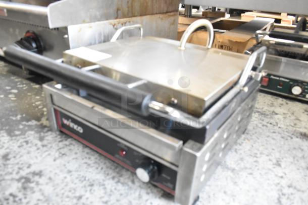 Winco EPG-1C Stainless Steel Commercial Panini Press, 120V, countertop model, slight wear, visible control knob, and branding.
