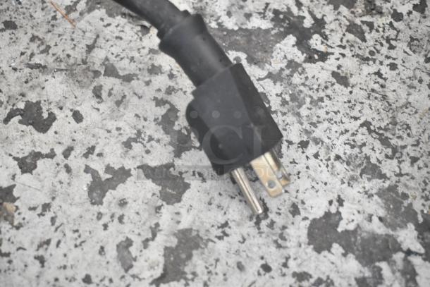 Power plug of a Winco EPG-1C Stainless Steel Commercial Panini Press, 120 volts, for countertop use.