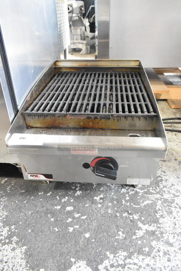 APW Wyott stainless steel gas charbroiler grill, commercial countertop model in used condition, featuring adjustable control knob.