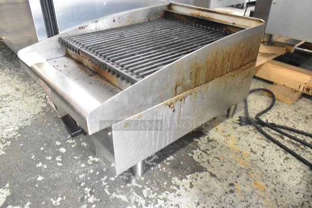 APW Wyott stainless steel gas charbroiler grill, used condition, visible grease and wear, ideal for commercial kitchens.
