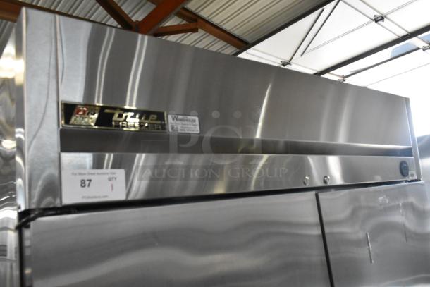 True TM-52F stainless steel commercial 2-door reach-in freezer, 115 volts, 1 phase, excellent condition, model label visible.