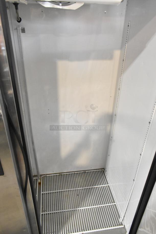 True TM-52F Stainless Steel Commercial 2 Door Reach-In Freezer interior. Clean, spacious shelving, suitable for 115V, 1 Phase.