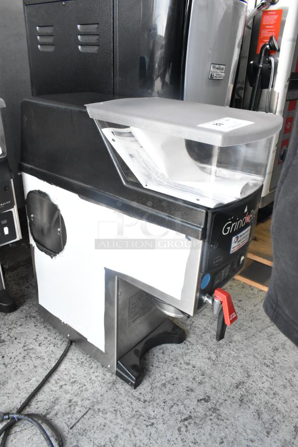Grindmaster Grind'n Brew-10H stainless steel coffee grinder and maker, with hot water dispenser and metal brew basket.