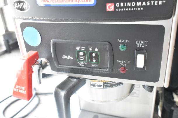 Grindmaster Grind'n Brew-10H stainless steel coffee maker with grinder, hot water dispenser, and metal brew basket. 120V.