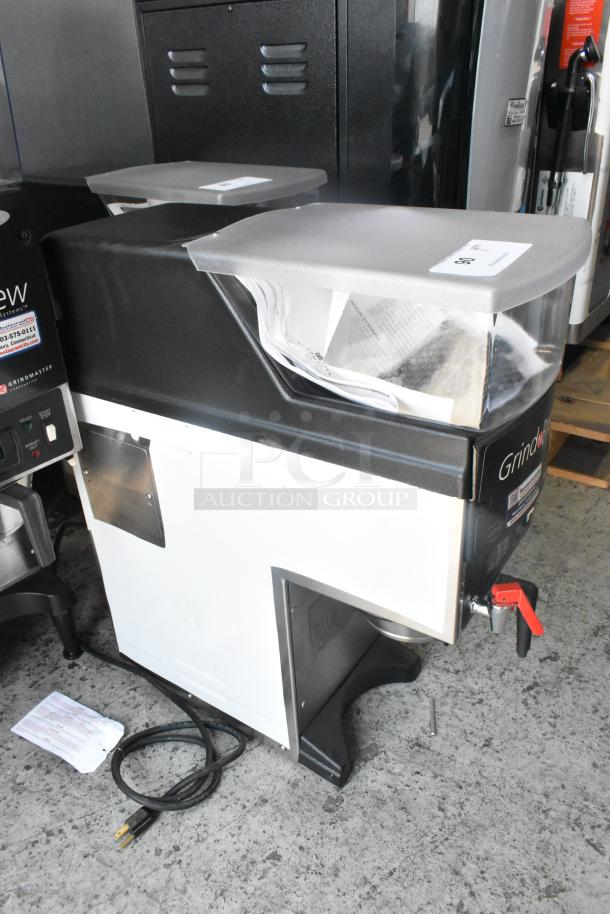 Grindmaster Grind'n Brew-10H commercial countertop coffee maker, stainless steel, with grinder, hot water dispenser, and metal brew basket.