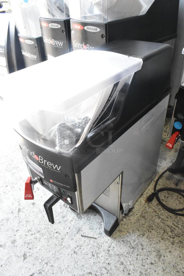 Grindmaster Grind'n Brew-10H stainless steel coffee maker, grinder, and hot water dispenser. Includes metal brew basket.