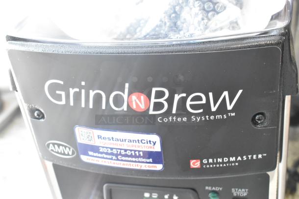 Grindmaster Grind'n Brew-10H coffee maker; stainless steel, commercial-grade, hot water dispenser, metal brew basket.