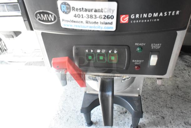 BRAND NEW Grindmaster RGNB-20H stainless steel coffee machine. Features hot water dispenser, metal brew basket, control panel, and labels.