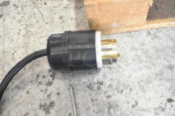 Plug of Necta Kolbalto espresso machine, showing a three-prong connector suitable for 208/250 volts, 1 phase power.