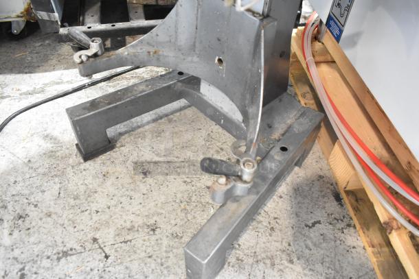Avantco MX20 metal commercial 20-quart planetary dough mixer base, showing sturdy construction and wear marks.