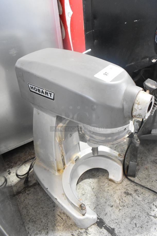 2017 Hobart Legacy HL200 20 Quart Planetary Dough Mixer, metal, 100-120V, 1 phase, visible wear, Hobart logo, auction label.
