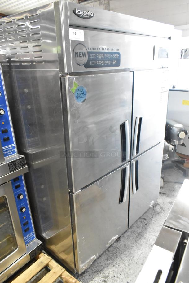 2023 Lassele LS-1045F stainless steel commercial freezer with four half-size doors, poly-coated racks, and commercial casters. Unable to test due to cut power cord.