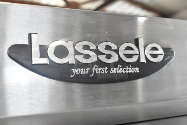 2023 Lassele LS-1045F stainless steel commercial freezer, four half-size doors, poly-coated racks, on casters, cut power cord.