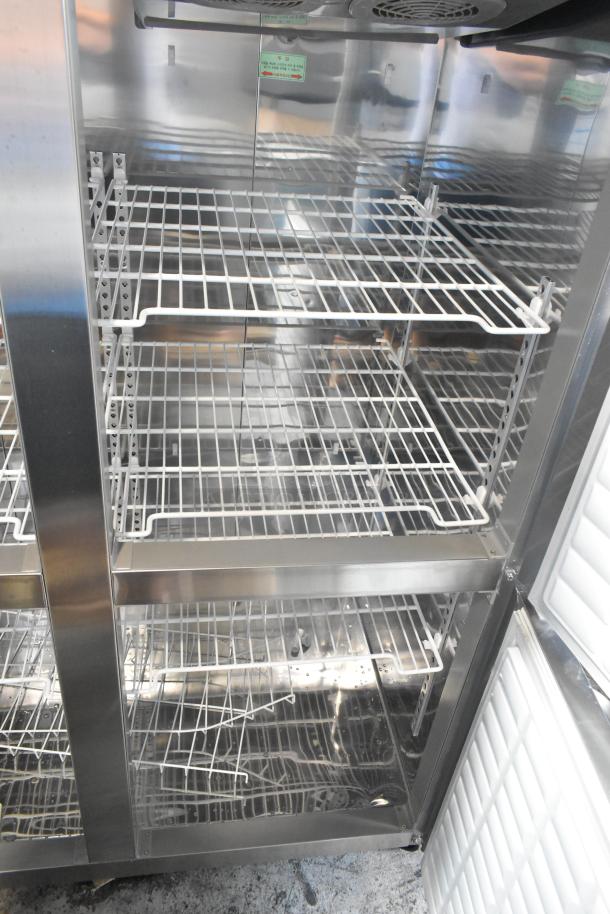 2023 Lassele LS-1045F stainless steel freezer, 4 half-size doors, poly-coated racks, on casters, cut power cord.