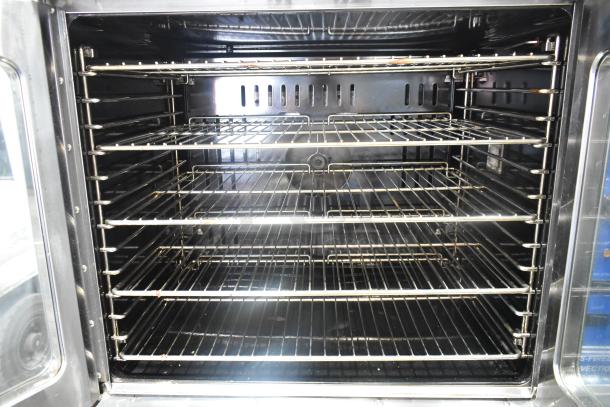 Cook Rite ATCO-513NB stainless steel convection oven with metal racks, view-through doors, and thermostatic controls.