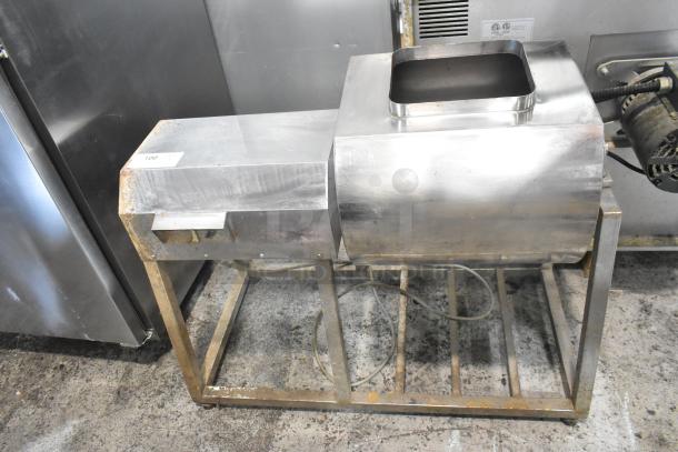 Metal commercial marinating station with steel frame, visible wear and oxidation. Auction tag "100" attached.