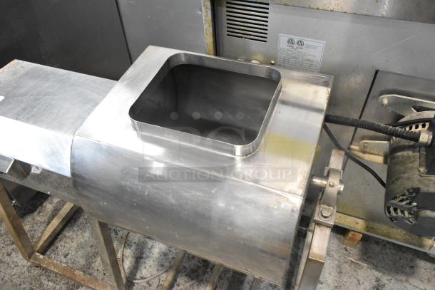 Metal commercial floor-style marinating station with stainless steel construction, open top, and visible motor. Good condition.