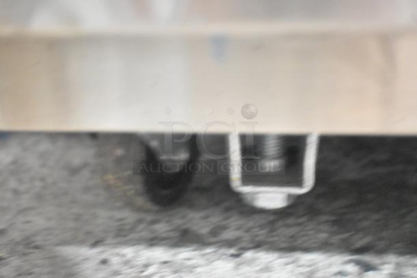 Stainless steel commercial cooler/freezer, 4 half-size doors, on casters, Unique brand, 115V, 1 phase.