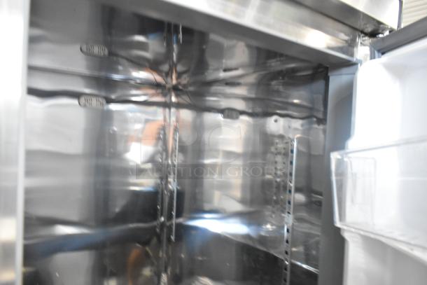 Unique stainless steel commercial cooler/freezer interior, four half-size doors, 115 volts, on casters, clean condition.
