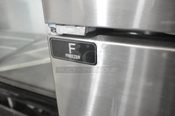 Unique stainless steel commercial 4 half-size door freezer label. 115 volts, 1 phase, on commercial casters.