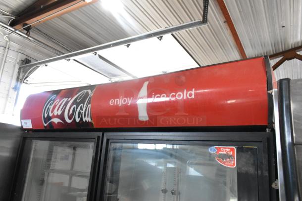 True GDM-49EM Metal Commercial 2 Door Reach In Cooler with signage, poly coated racks, 115V, 1 Phase.