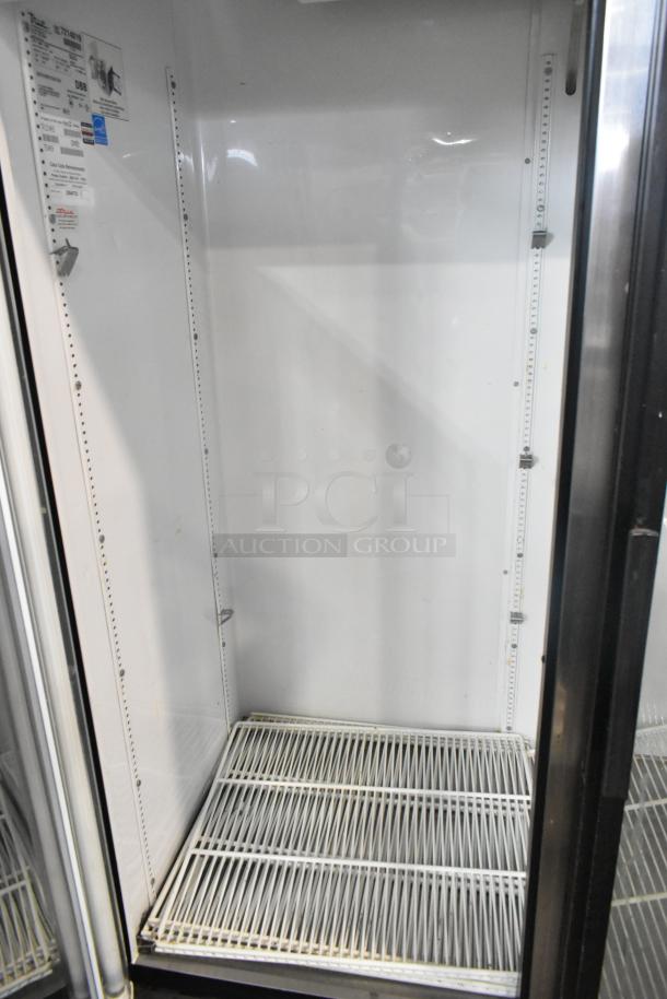 True GDM-49EM metal commercial 2-door reach-in cooler, poly-coated racks, 115V, 1-phase, clean interior, visible model label.