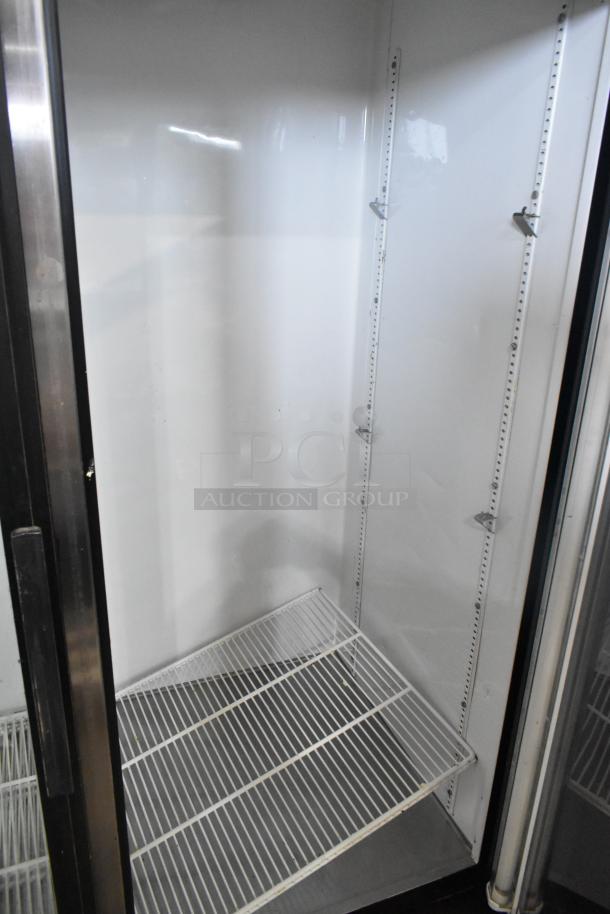 True GDM-49EM metal commercial cooler, 2-door, poly-coated racks, 115 volts, 1 phase, excellent condition, empty interior.