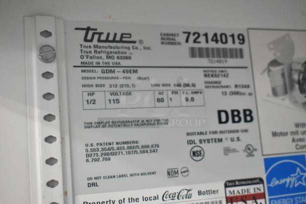 True GDM-49EM commercial cooler label showing model, serial number, voltage (115V), phase (1), and energy certifications.