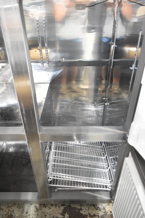 Unique stainless steel commercial reach-in cooler/freezer with four half-size doors, poly-coated racks, on commercial casters.