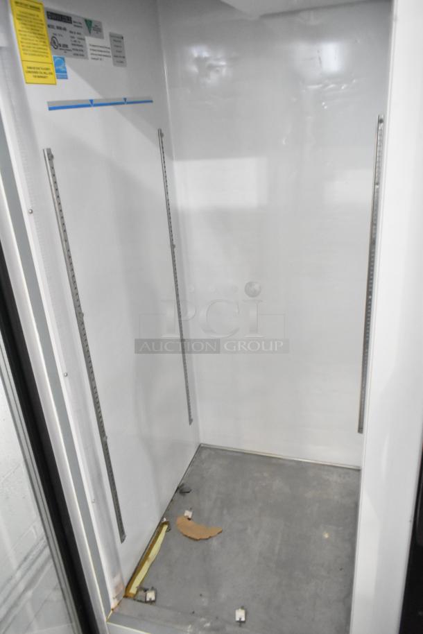 Maxx Cold MXM2-48R commercial cooler interior. Two-door design, 115 volts, 1 phase. Slight wear visible.